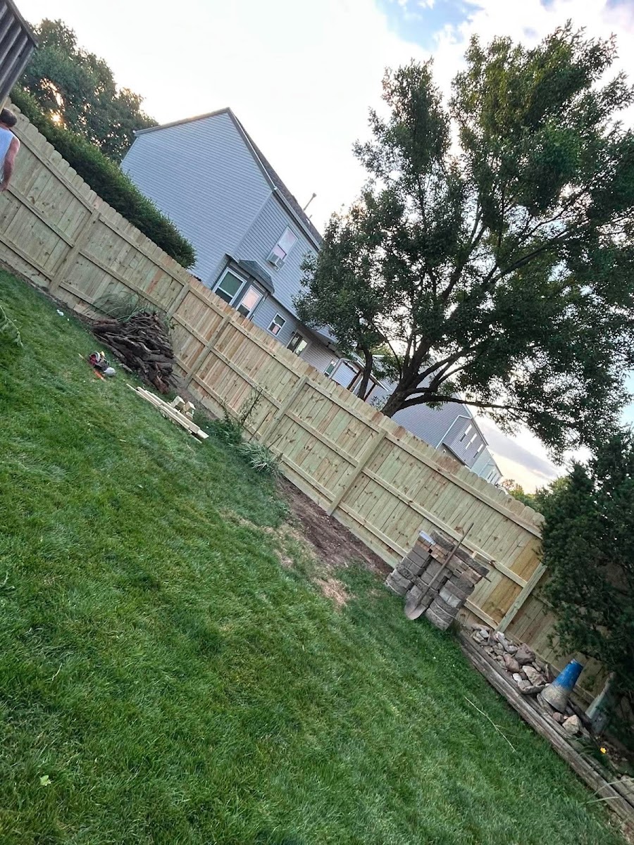 New wood privacy fence installed on a sloped Columbus, Ohio backyard